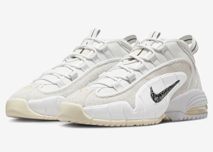 Grey and white Nike Penny shoes.